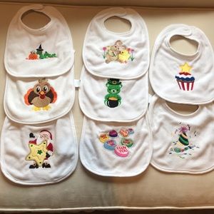 8 holiday bibs-NWOT (never used)
